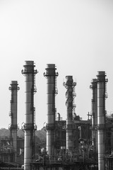 Oil Refinery reflected light water sunset industry in Thailand.