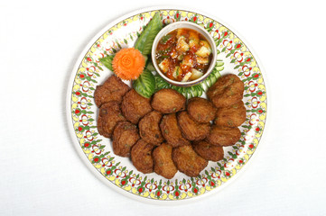minced pork ball mixed with herb fried serving with red chili sauce top view 
