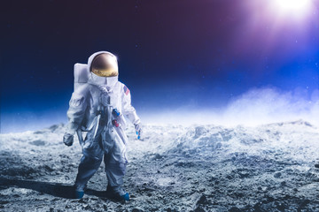 Astronaut walking on the moon - obrazy, fototapety, plakaty