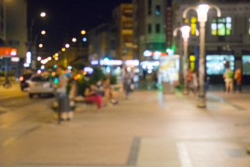 abstract blurred background of people walking in city center