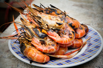 Grilled shrimps on the flaming grill.