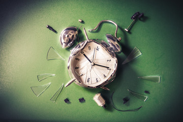 late for school concept with alram clock on a blackboard