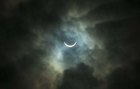 Solar Eclipse Through Thick Clouds
