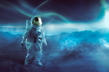 Obraz na płótnie Canvas Astronaut walking on an unexplored planet