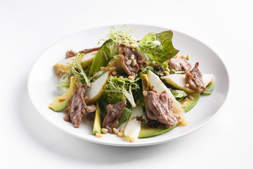 Salad with duck breast and pine nuts