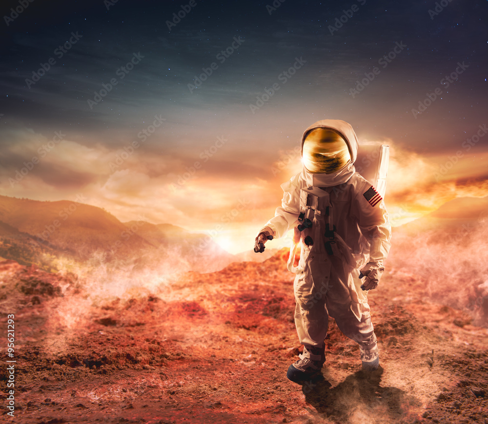 Wall mural astronaut walking on an unexplored planet
