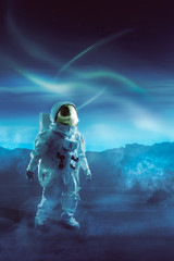 Fototapeta premium Astronaut walking on an unexplored planet