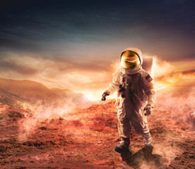 Astronaut walking on an unexplored planet © fergregory