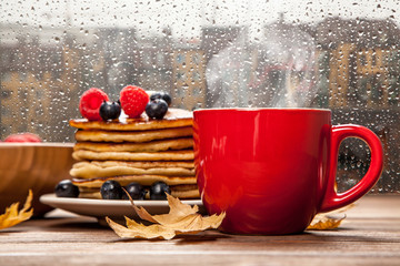 Cup of coffee and pancakes
