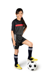 Young asian girl playing soccer, Isolated over white