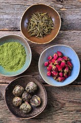 Fototapeta na wymiar Tea - big leaf green tea rose, powder Matcha tea, flowering tea