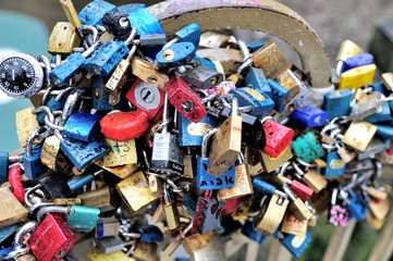 dozens of love padlocks pinned on the bridge of Prague