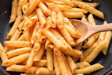 Penne pasta with tomato sauce in a pan