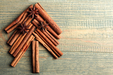 cinnamon with anise on wooden background