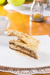 Napoleon cake on plate on table close-up