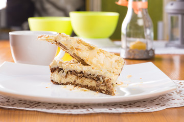 Napoleon cake on plate on table close-up