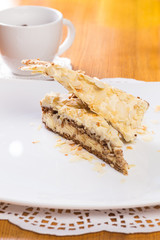 Napoleon cake on plate on table close-up