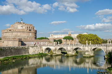 Fototapeta na wymiar Historic Landmark architecture Eliyev build a bridge to the Castel Sant'Angelo in Rome, on the banks of the Tiber River near the arched bridge across the river on a bright sunny day