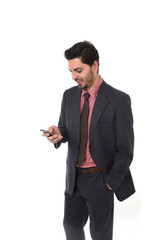 corporate portrait of young attractive businessman of Latin Hispanic ethnicity with mobile phone