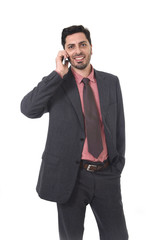 corporate portrait of young attractive businessman of Latin Hispanic ethnicity talking on mobile phone