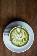 Matcha Green Tea Latte on Wooden Background