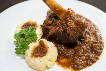 Grilled lamb steak with spicy chili sauce.