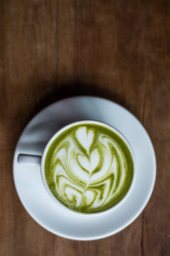 Matcha Green Tea Latte on Wooden Background