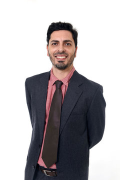 corporate portrait young attractive businessman of Hispanic ethnicity smiling in suit and tie
