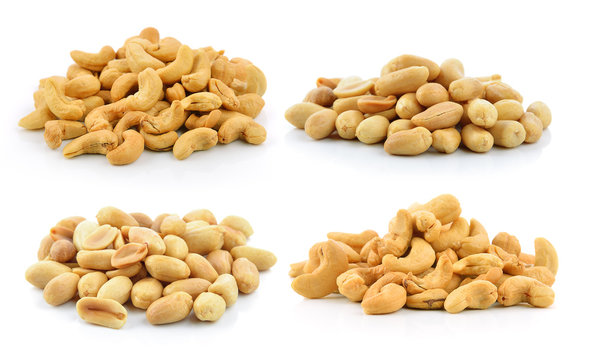 cashew nuts heap and peanuts on white background