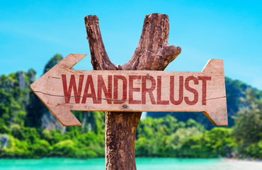 Wanderlust arrow with beach background