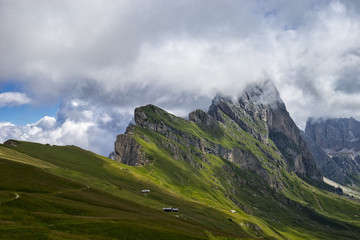 Fototapeta premium Seceda peak with clouds, Odle mountain range, Gardena Valley, Do