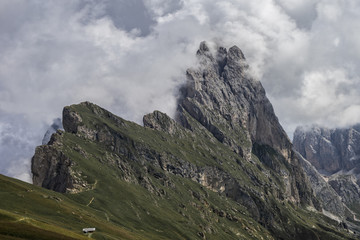 Fototapeta premium Seceda peak with clouds, Odle mountain range, Gardena Valley, Do