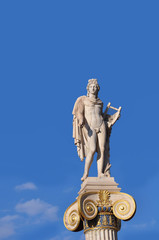 Statue of Apollo on top of a pillar in front Academy of Athens, Greece