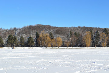 a frozen lake in the highlands