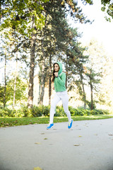 Fototapeta premium Young woman running in the park