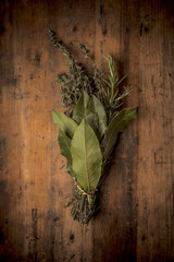 Herbs on a rustic wood background