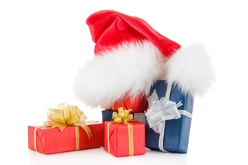 Red santa hat with gifts isolated on white