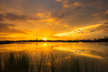 Wonderful sunset landscape over the calm lake