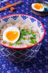 Vegetarian soup of rice noodles with parsley and boiled egg