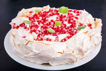 Pavlova cake with pomegranate