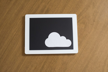 Digital tabet and cloud computing symbol