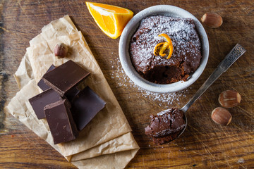 Chocolate and orange cupcake with coffee