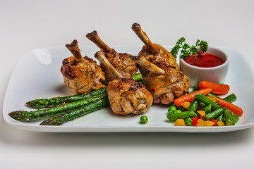 chicken legs with asparagus and ketchup