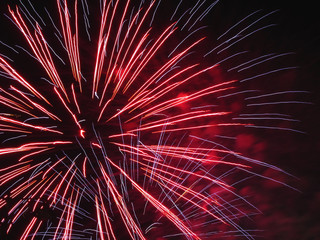 Colorful fireworks of various colors light up the night sky