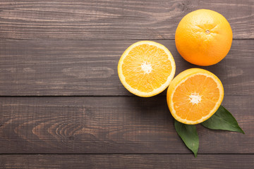Fresh organic oranges fruits on wooden background