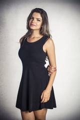Fototapeta premium Attractive model posing in a black dress