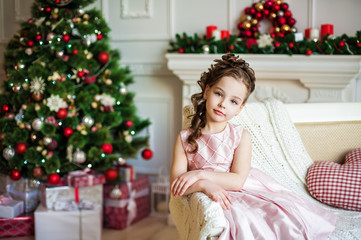 Portrait of the girl near christmas tree