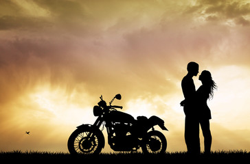 Fototapeta na wymiar couple kissing on motorcycle