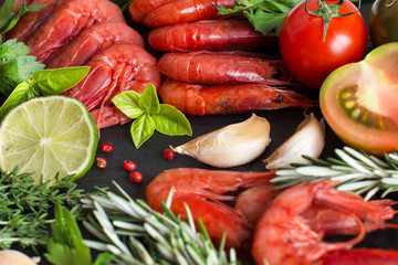Raw shrimps with tomatoes,  lime and herbs