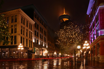 Fototapeta na wymiar Gastown Vancouver Night, BC, Canada. Reflections on a rainy night in Vancouver's famous Gastown district. 
